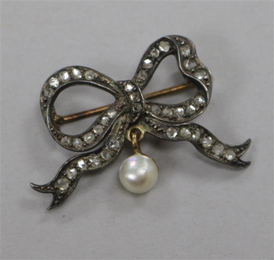 A Victorian yellow metal, rose cut diamond and drop pearl bow brooch, 30mm.